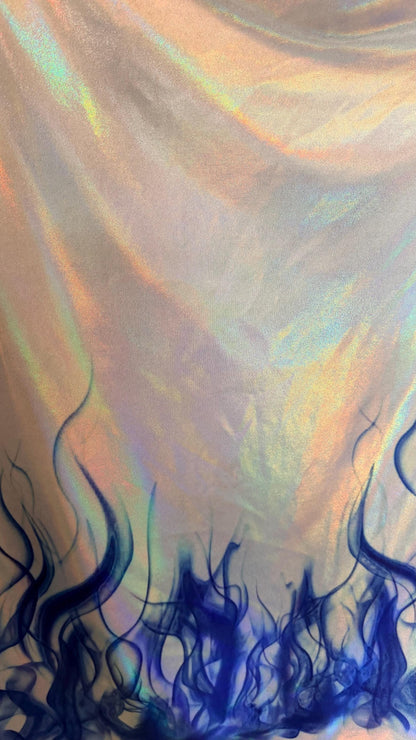 Flames design Black/Fire and White/Sapphire on Iridescent Hologram metallic nylon spandex 4-way stretch 58/60” Sold by the YD.