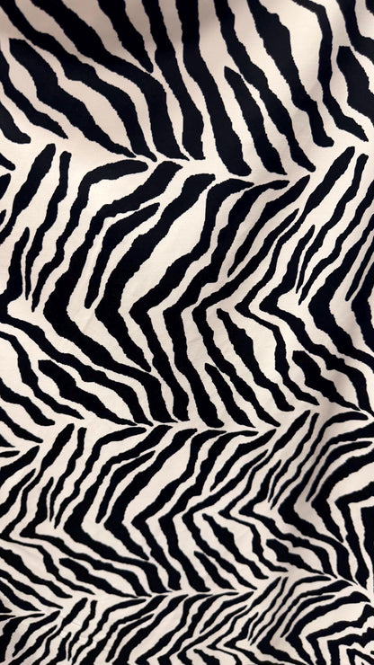 New Exotic zebra design medium size white/black & Taupe/Black print on best quality of nylon spandex 4-way stretch 58/60” Sold by the YD.
