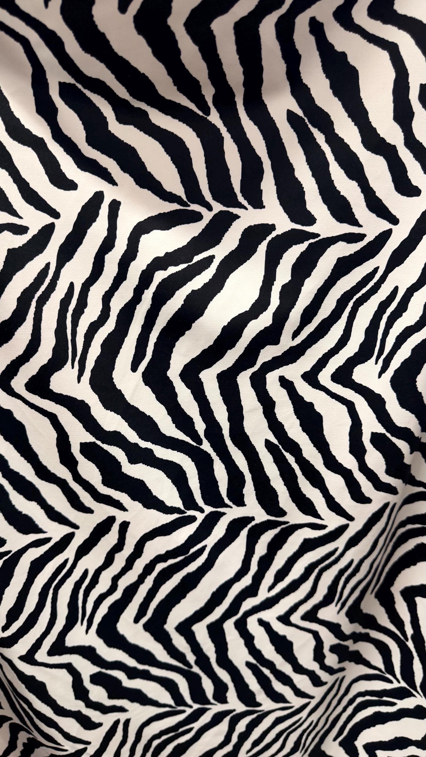 New Exotic zebra design medium size white/black & Taupe/Black print on best quality of nylon spandex 4-way stretch 58/60” Sold by the YD.