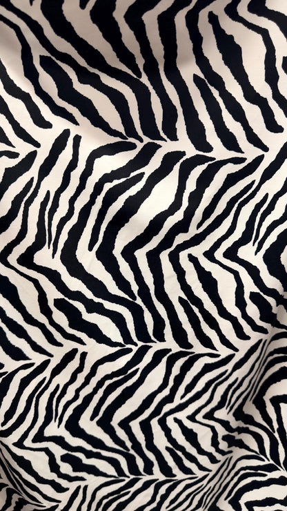 New Exotic zebra design medium size white/black & Taupe/Black print on best quality of nylon spandex 4-way stretch 58/60” Sold by the YD.