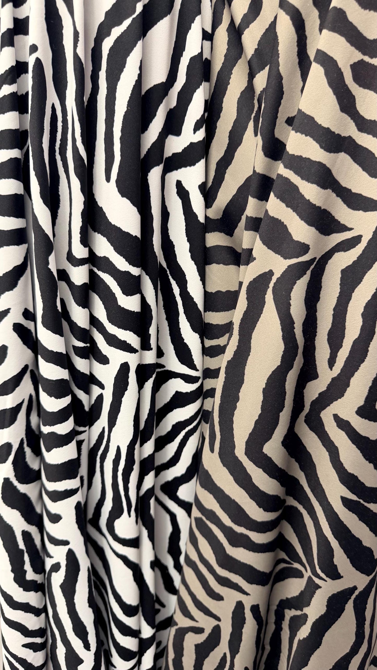 New Exotic zebra design medium size white/black & Taupe/Black print on best quality of nylon spandex 4-way stretch 58/60” Sold by the YD.