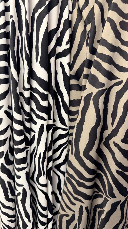 New Exotic zebra design medium size white/black & Taupe/Black print on best quality of nylon spandex 4-way stretch 58/60” Sold by the YD.