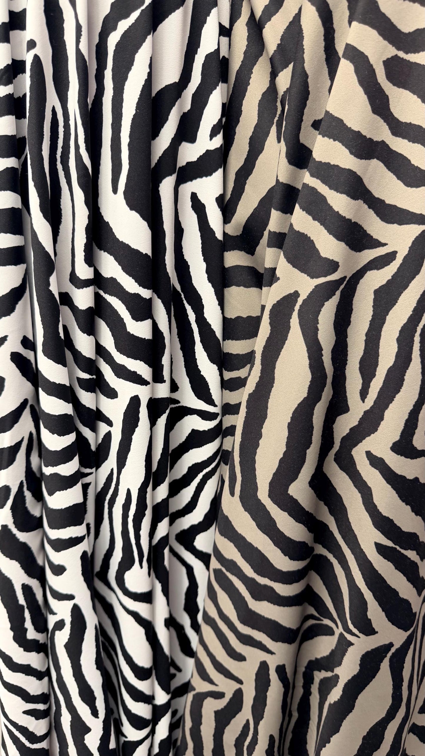 New Exotic zebra design medium size white/black & Taupe/Black print on best quality of nylon spandex 4-way stretch 58/60” Sold by the YD.