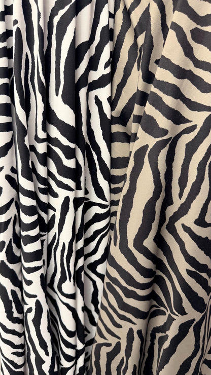 New Exotic zebra design medium size white/black & Taupe/Black print on best quality of nylon spandex 4-way stretch 58/60” Sold by the YD.