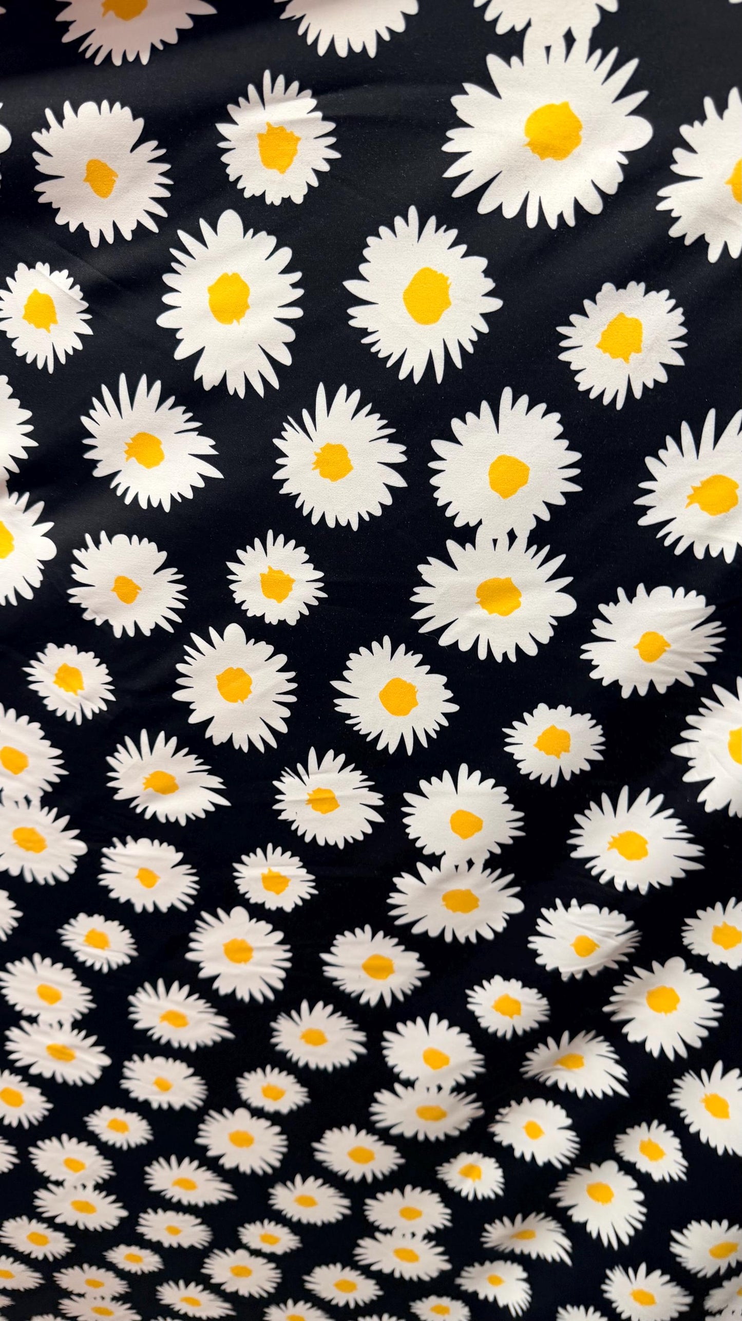 New Daisy flower design Black/white/yellow print on great quality of nylon spandex 4-way stretch 58/60” Sold by the YD.