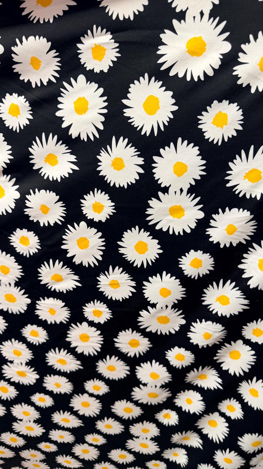 New Daisy flower design Black/white/yellow print on great quality of nylon spandex 4-way stretch 58/60” Sold by the YD.