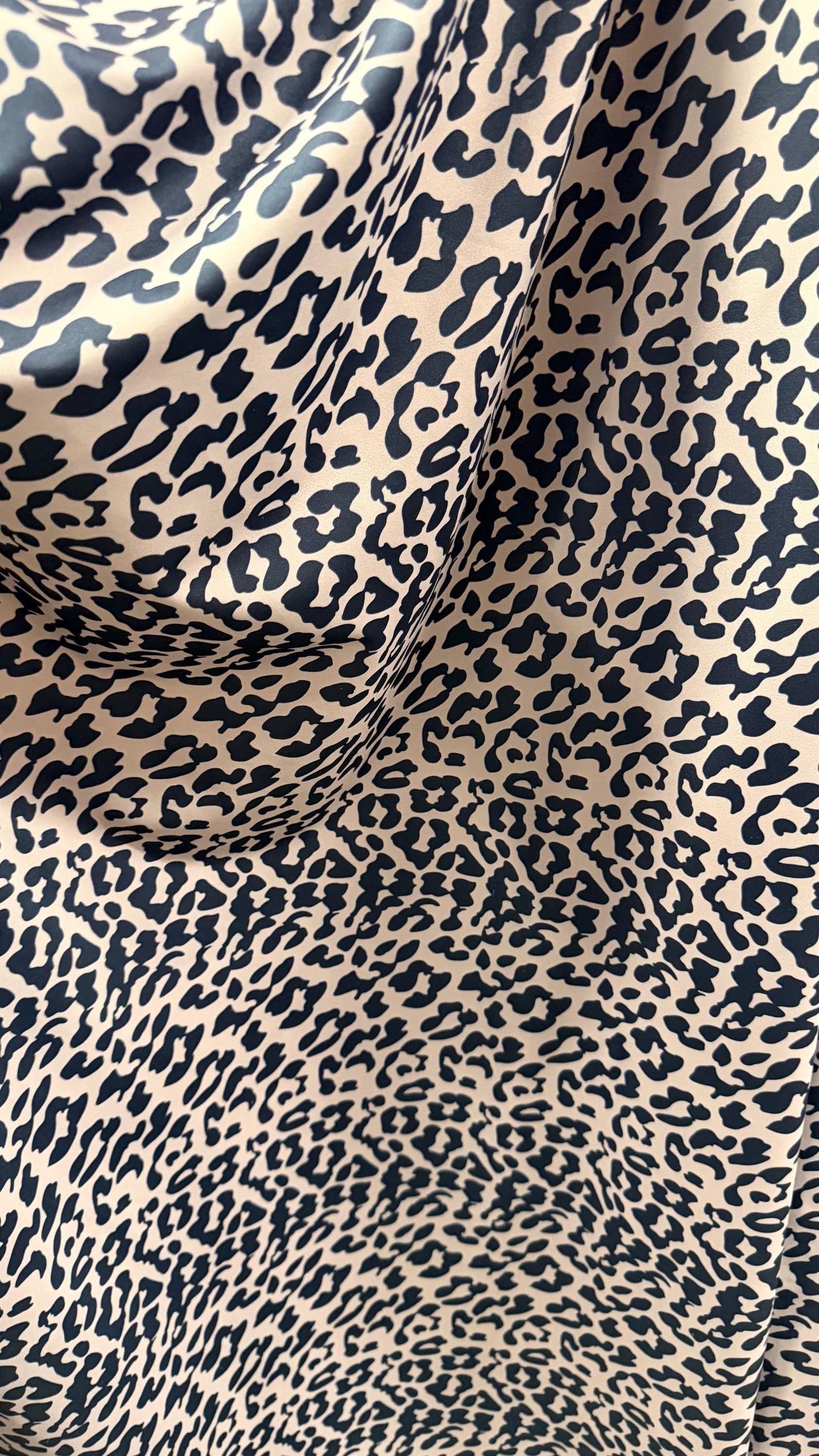 New Exotic Leopard design Taupe/Black print on nylon spandex 4way stretch 58/60" Sold by the YD. Ships worldwide from Los Angeles CA