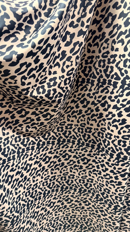 New Exotic Leopard design Taupe/Black print on nylon spandex 4way stretch 58/60" Sold by the YD. Ships worldwide from Los Angeles CA