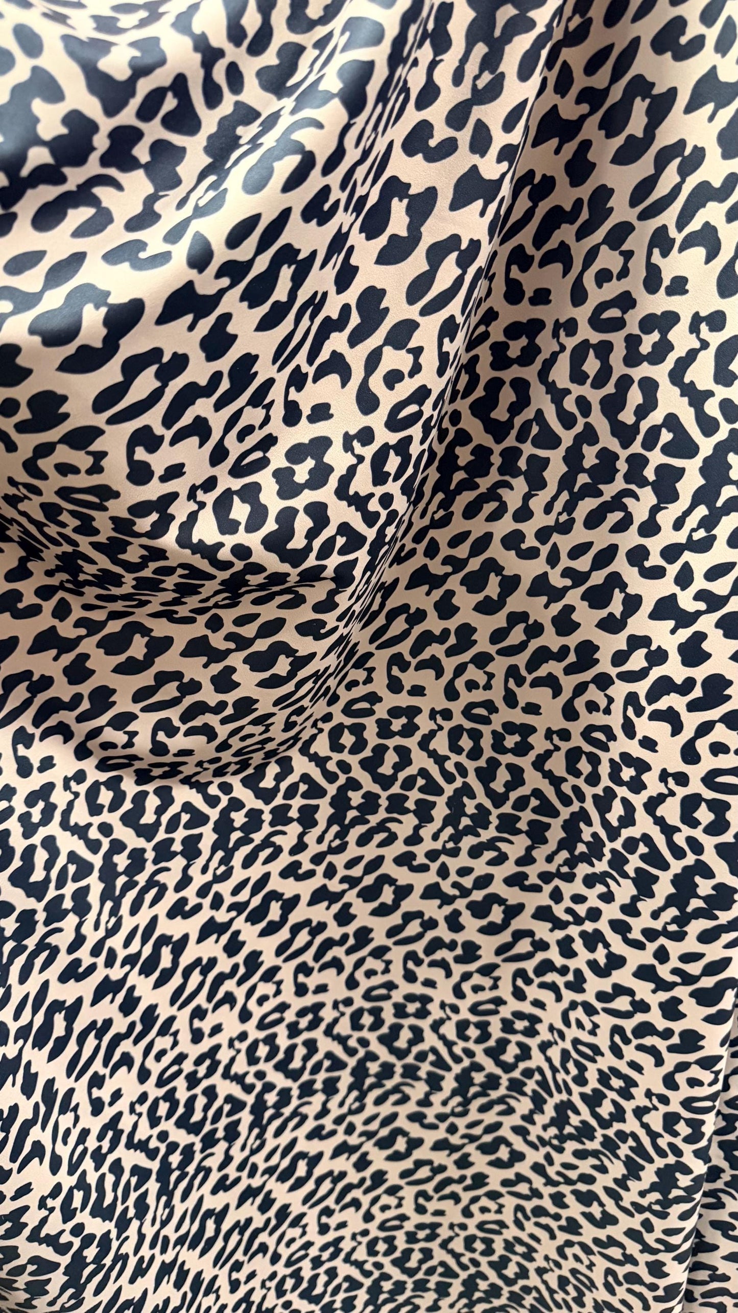 New Exotic Leopard design Taupe/Black print on nylon spandex 4way stretch 58/60" Sold by the YD. Ships worldwide from Los Angeles CA