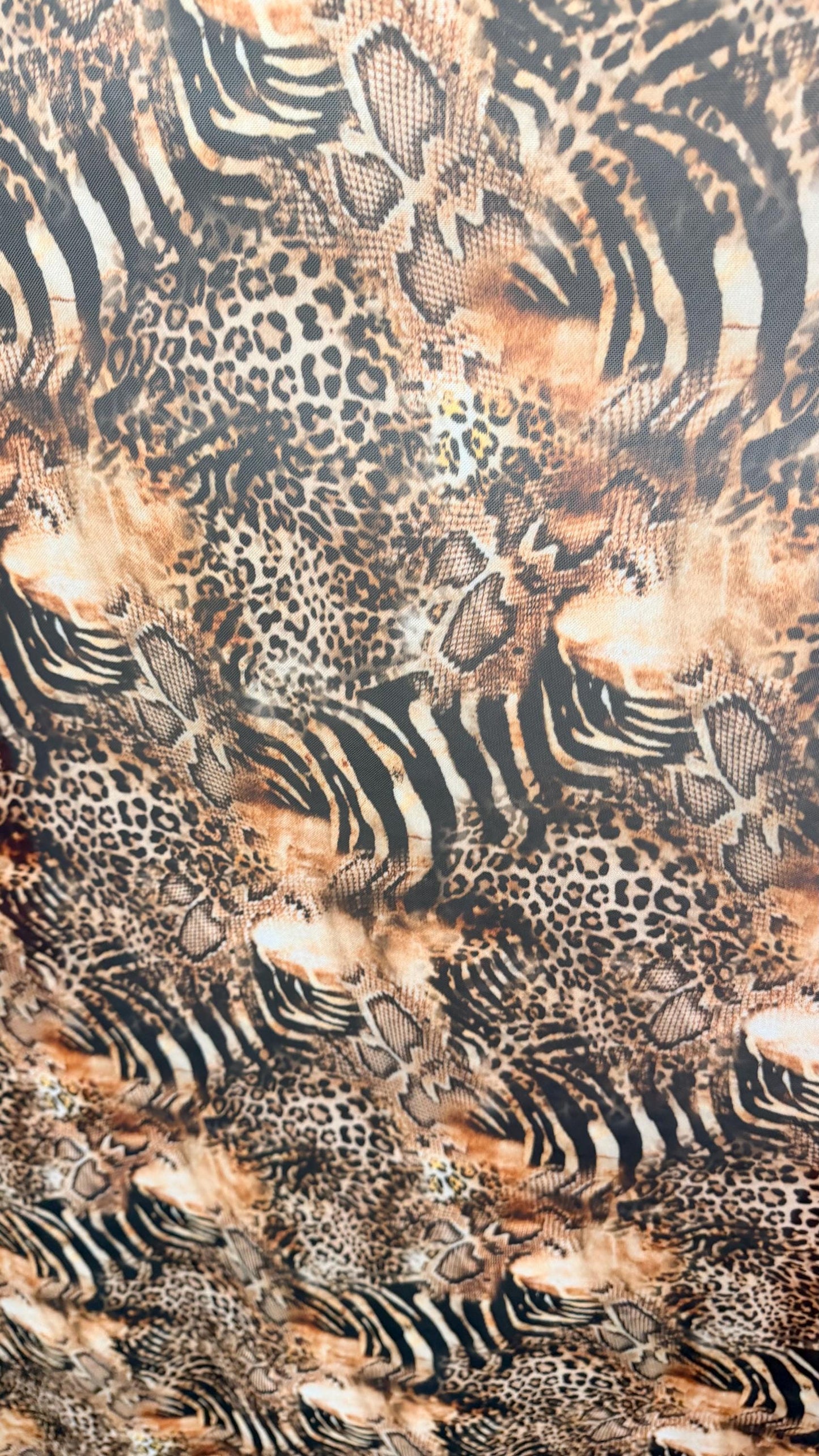 New Exotic Hiding Multi animal design print on great quality of power mesh nylon spandex 4way stretch 58/60” Sold by the YD. Ships Worldwide