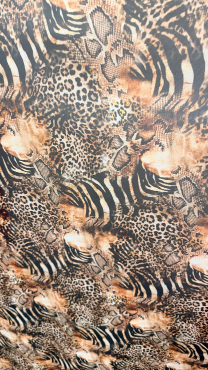 New Exotic Hiding Multi animal design print on great quality of power mesh nylon spandex 4way stretch 58/60” Sold by the YD. Ships Worldwide