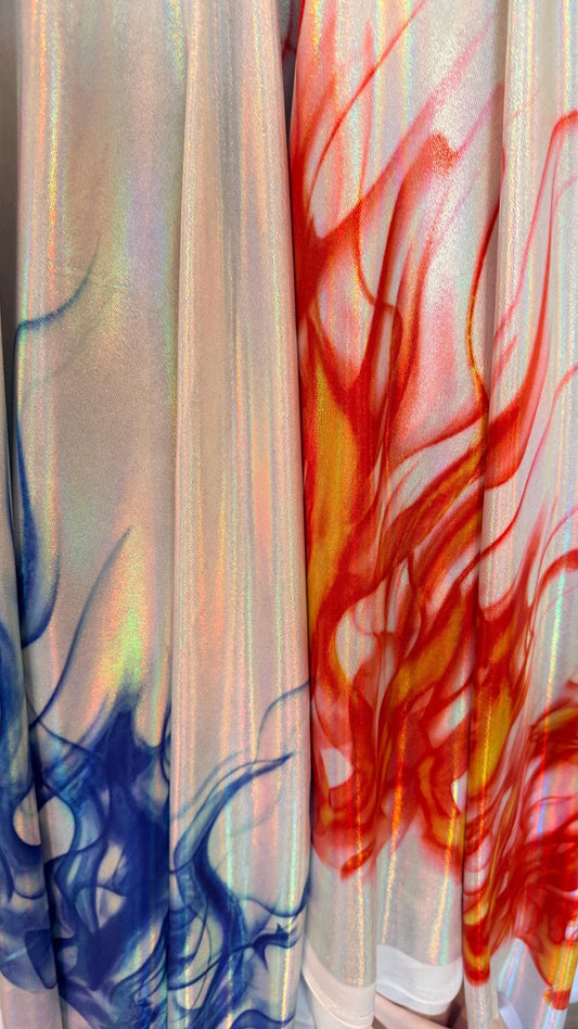 Flames design Black/Fire and White/Sapphire on Iridescent Hologram metallic nylon spandex 4-way stretch 58/60” Sold by the YD.
