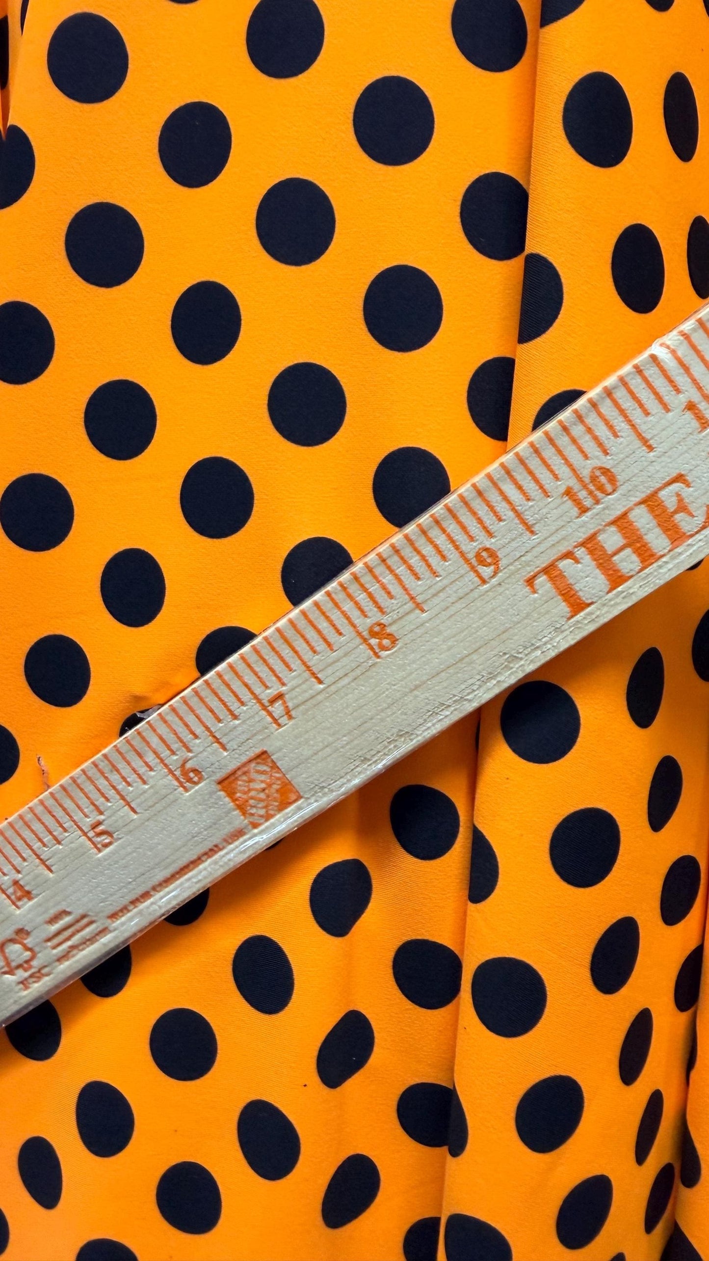 New polka dots design neon orange with black dots nylon spandex 4-way stretch 58/60” Sold by the YD. Ships worldwide from Los Angeles CA