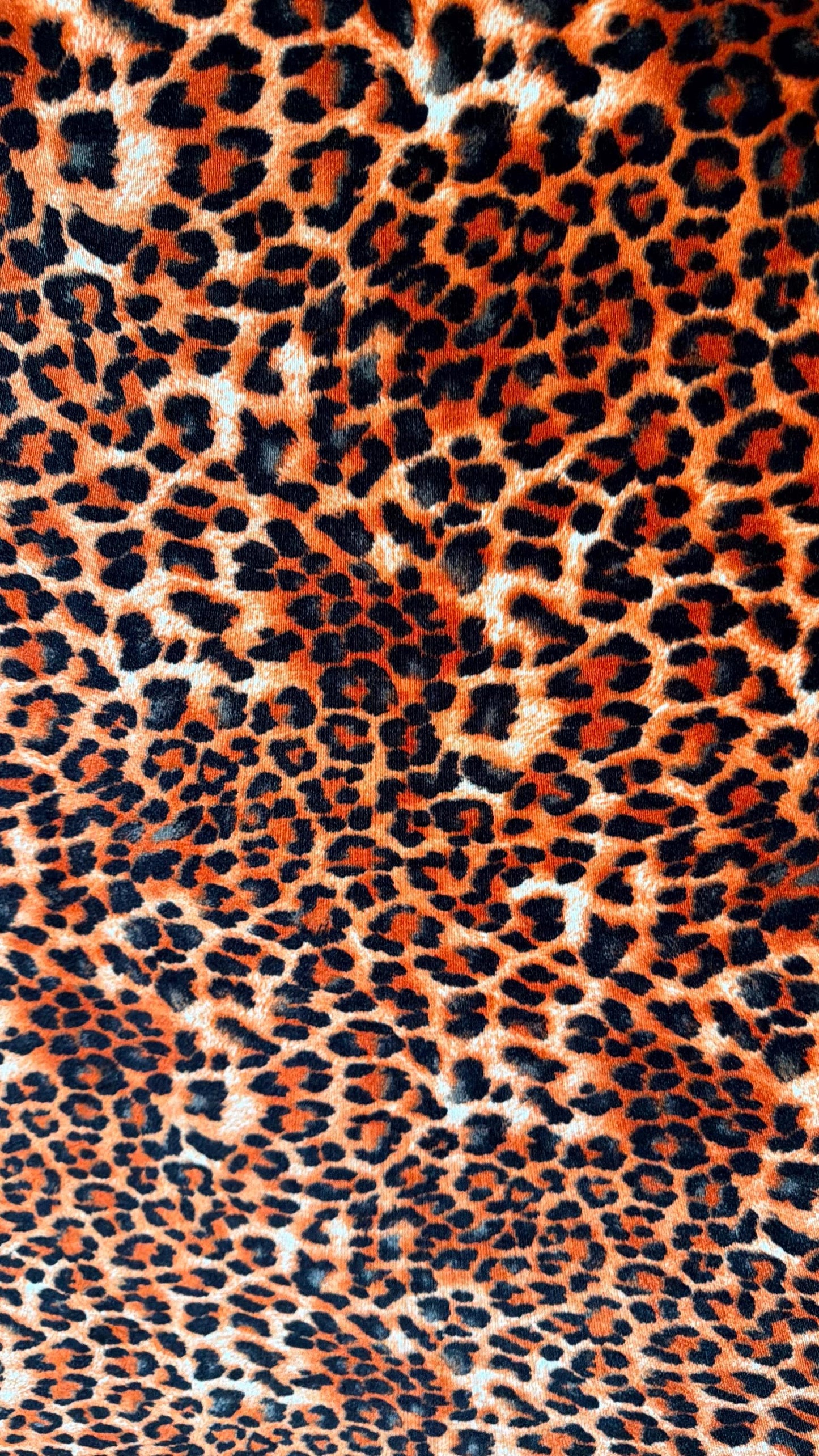 New Leopard print Orange/Black on heavy stretch velvet 4way stretch 58/60" Sold by the YD. Ships worldwide from Los Ángeles California USA.
