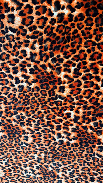 New Leopard print Orange/Black on heavy stretch velvet 4way stretch 58/60" Sold by the YD. Ships worldwide from Los Ángeles California USA.