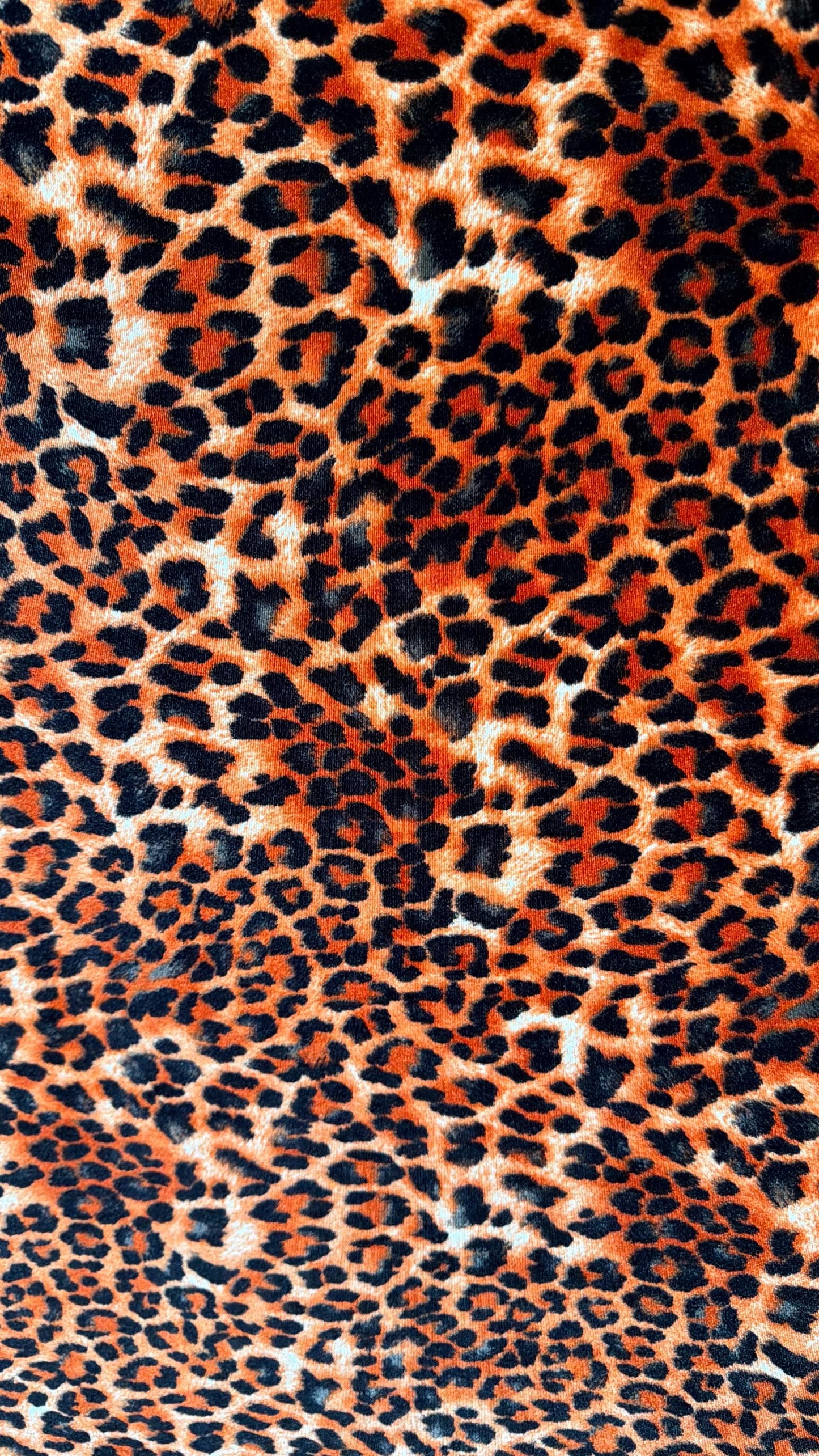 New Leopard print Orange/Black on heavy stretch velvet 4way stretch 58/60" Sold by the YD. Ships worldwide from Los Ángeles California USA.