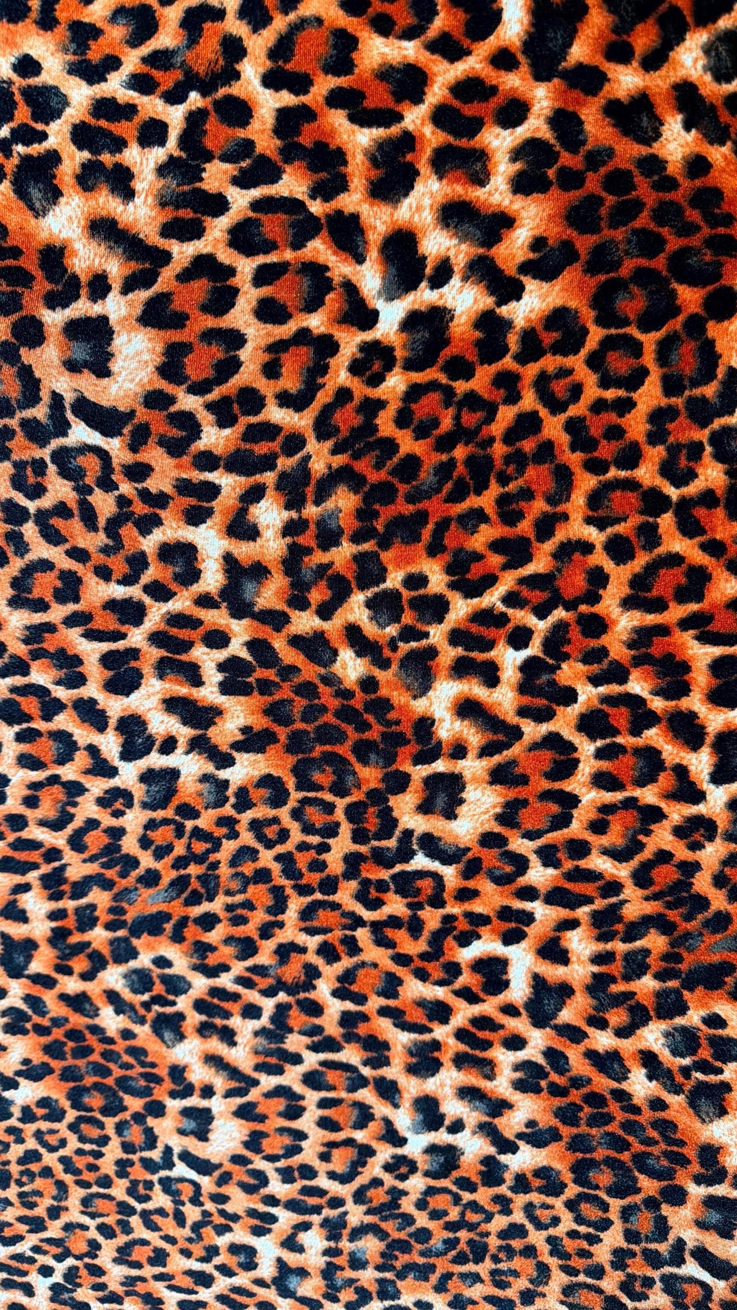 New Leopard print Orange/Black on heavy stretch velvet 4way stretch 58/60" Sold by the YD. Ships worldwide from Los Ángeles California USA.