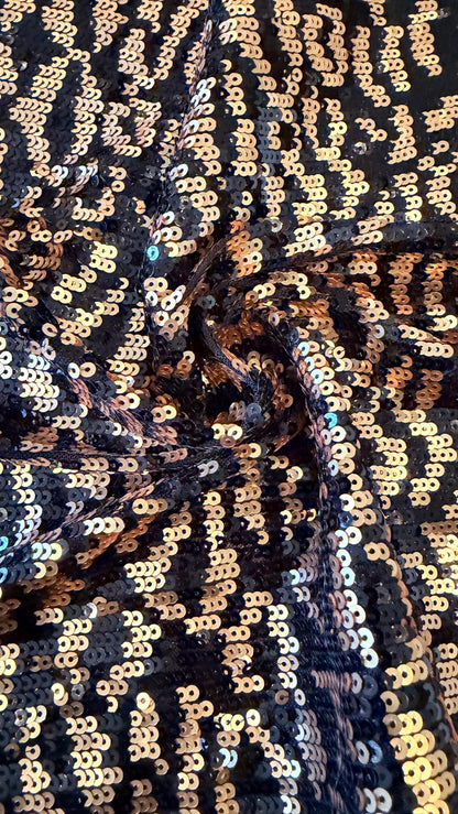 New Exotic leopard design Black/Gold on glitz cosmic sequins embroidered on powe mesh 2-way stretch 34/36” Sold by the YD.