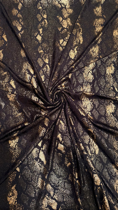 New Luxury snake design black/gold metallic nylon spandex with foil  4 way stretch 58/60” Sold by the YD. Ships worldwide from Los Angeles