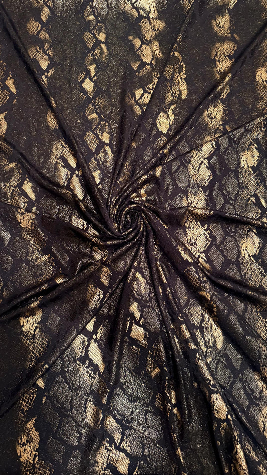 New Luxury snake design black/gold metallic nylon spandex with foil  4 way stretch 58/60” Sold by the YD. Ships worldwide from Los Angeles