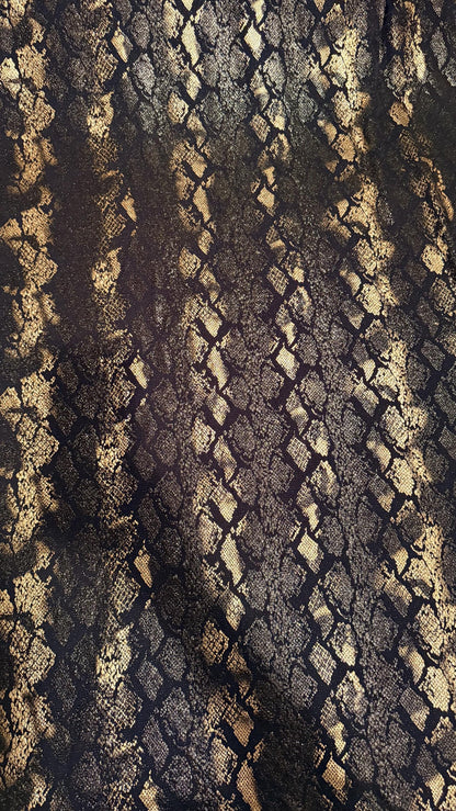 New Luxury snake design black/gold metallic nylon spandex with foil  4 way stretch 58/60” Sold by the YD. Ships worldwide from Los Angeles