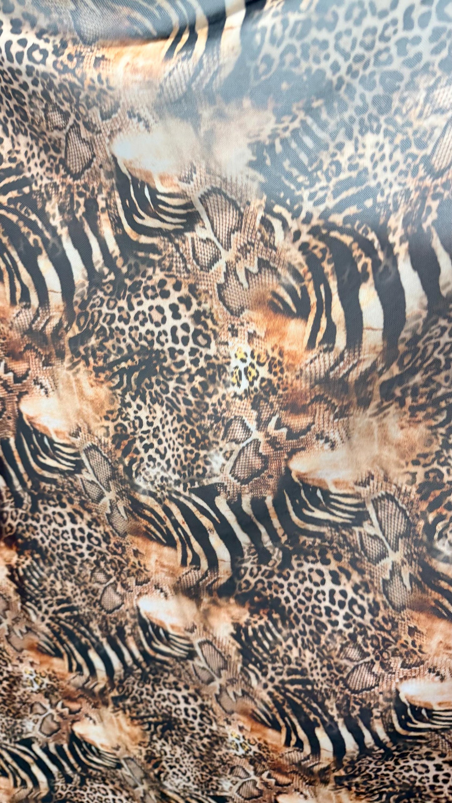 New Exotic Hiding Multi animal design print on great quality of power mesh nylon spandex 4way stretch 58/60” Sold by the YD. Ships Worldwide