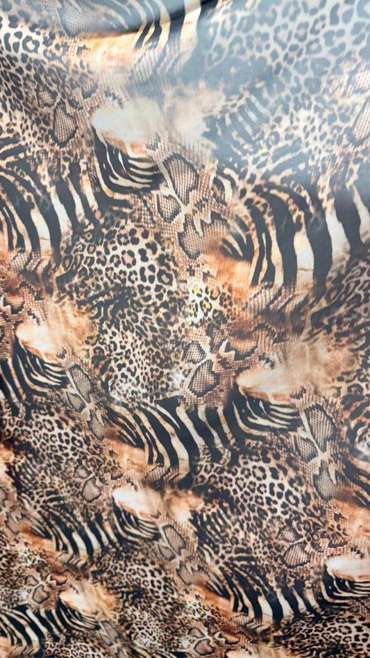 New Exotic Hiding Multi animal design print on great quality of power mesh nylon spandex 4way stretch 58/60” Sold by the YD. Ships Worldwide