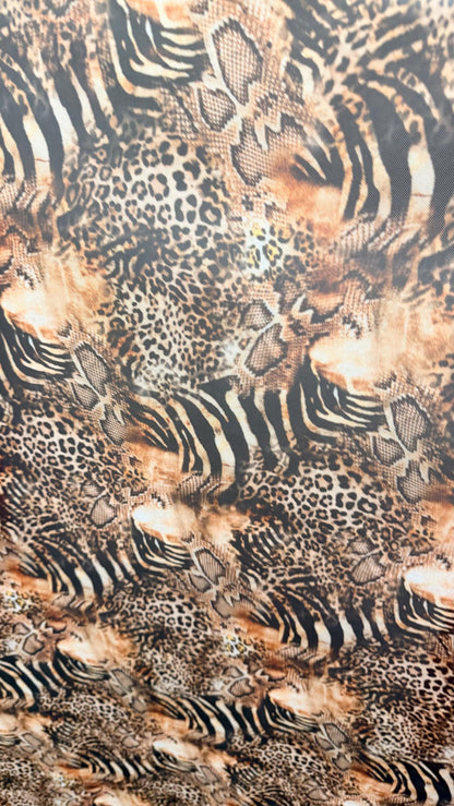 New Exotic Hiding Multi animal design print on great quality of power mesh nylon spandex 4way stretch 58/60” Sold by the YD. Ships Worldwide
