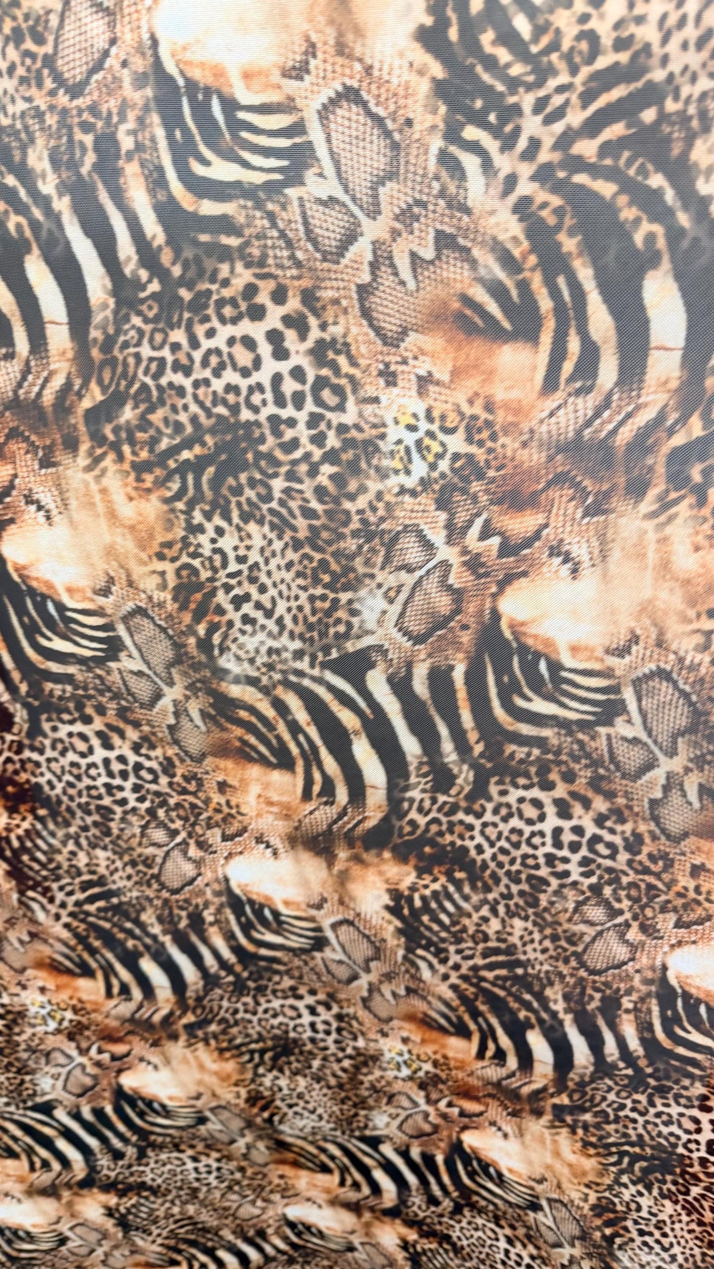 New Exotic Hiding Multi animal design print on great quality of power mesh nylon spandex 4way stretch 58/60” Sold by the YD. Ships Worldwide