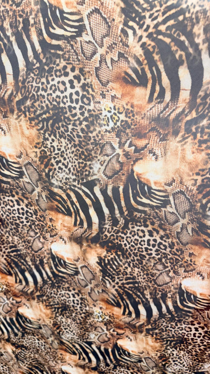 New Exotic Hiding Multi animal design print on great quality of power mesh nylon spandex 4way stretch 58/60” Sold by the YD. Ships Worldwide