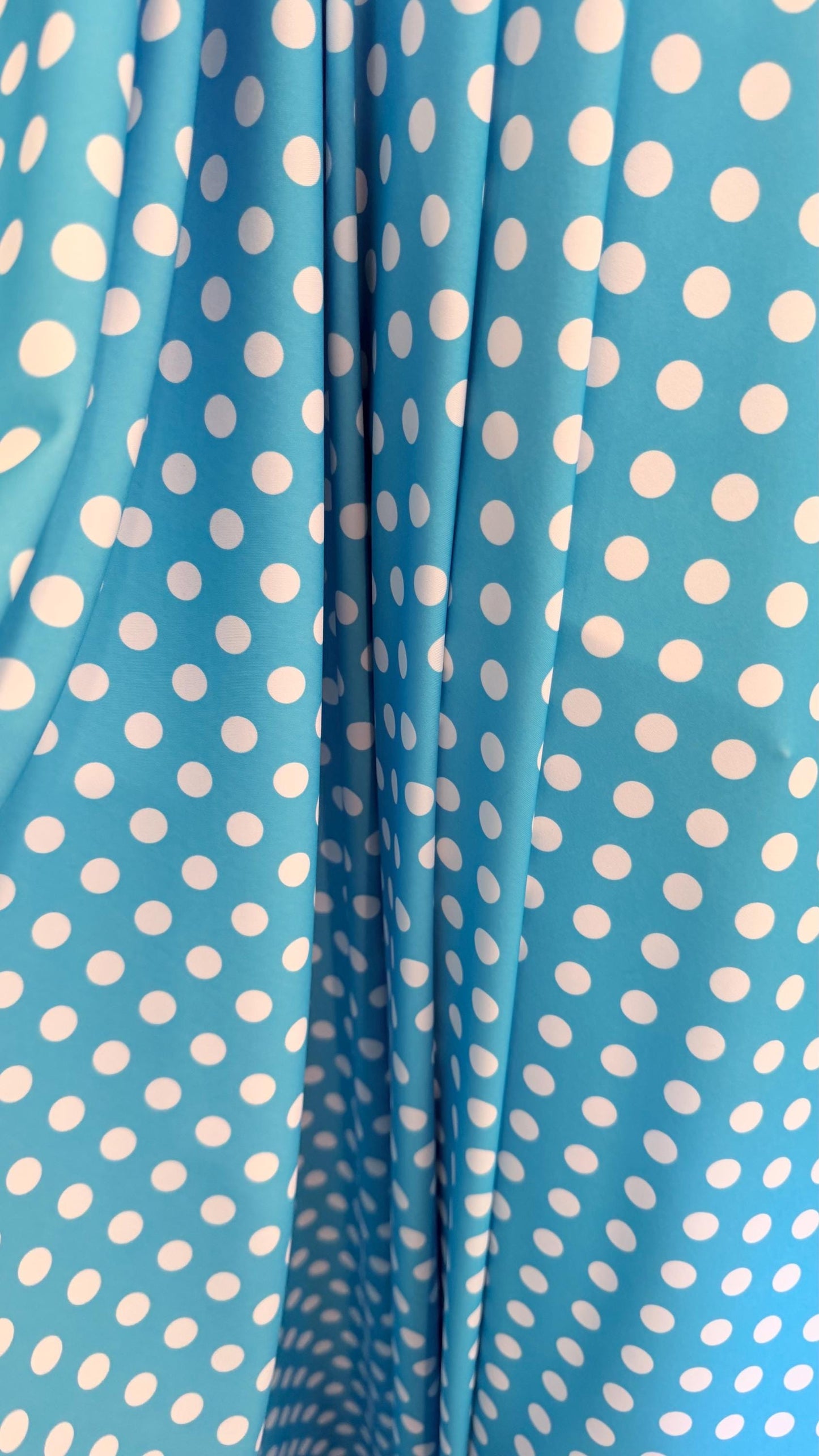 Polka dots design Aqua/White print on nylon spandex 4way stretch  58/60" sold by the Yd. Ships worldwide from Los Angeles California USA.