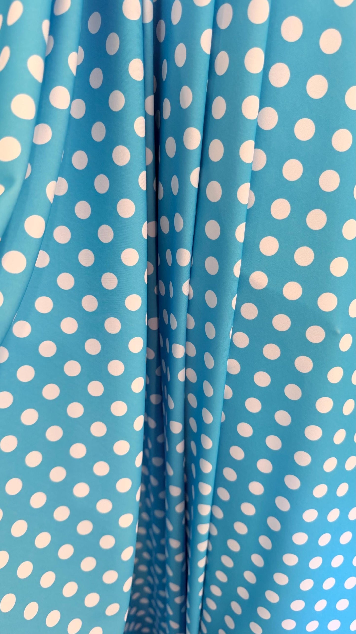 Polka dots design Aqua/White print on nylon spandex 4way stretch  58/60" sold by the Yd. Ships worldwide from Los Angeles California USA.
