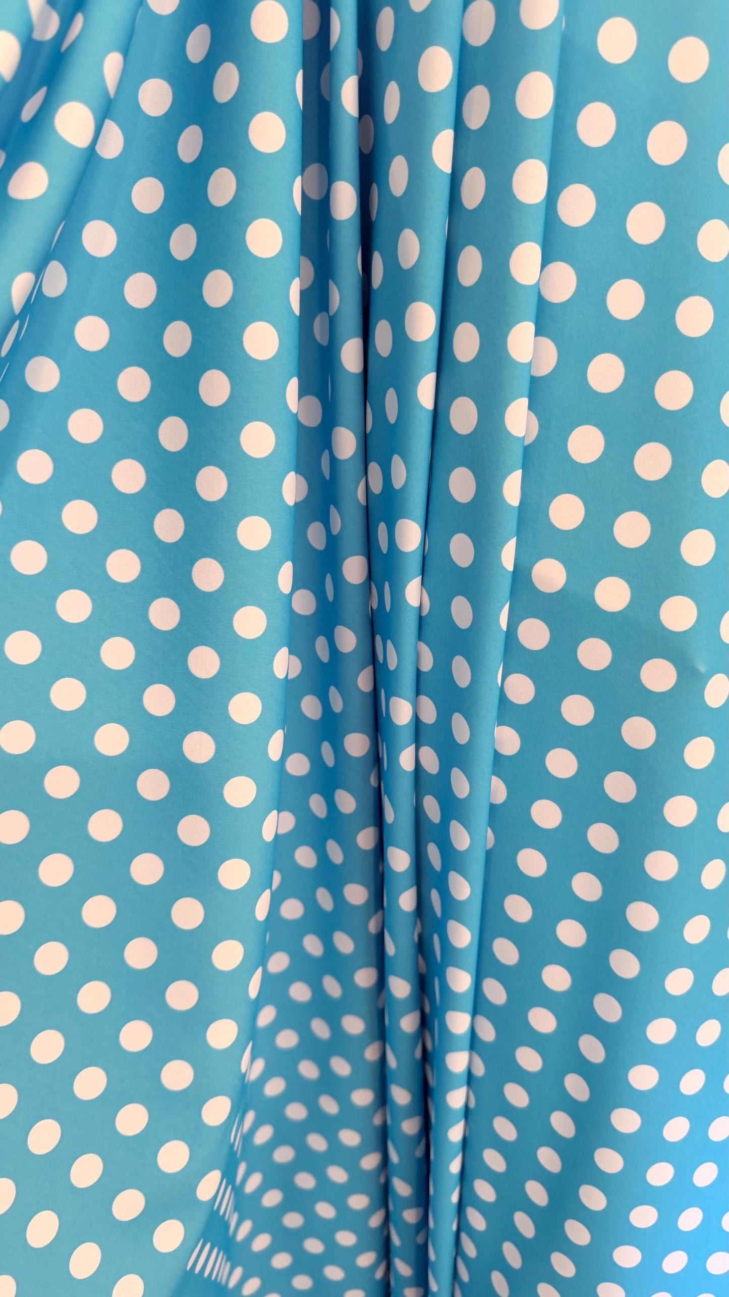 Polka dots design Aqua/White print on nylon spandex 4way stretch  58/60" sold by the Yd. Ships worldwide from Los Angeles California USA.