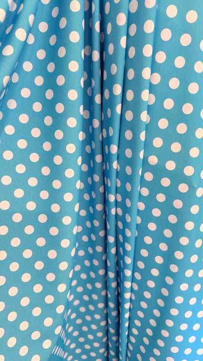 Polka dots design Aqua/White print on nylon spandex 4way stretch  58/60" sold by the Yd. Ships worldwide from Los Angeles California USA.