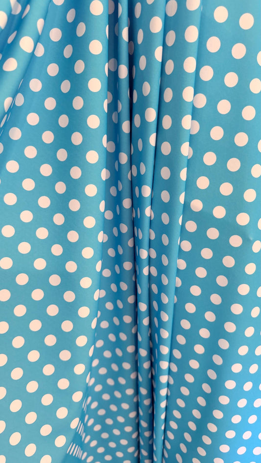 Polka dots design Aqua/White print on nylon spandex 4way stretch  58/60" sold by the Yd. Ships worldwide from Los Angeles California USA.