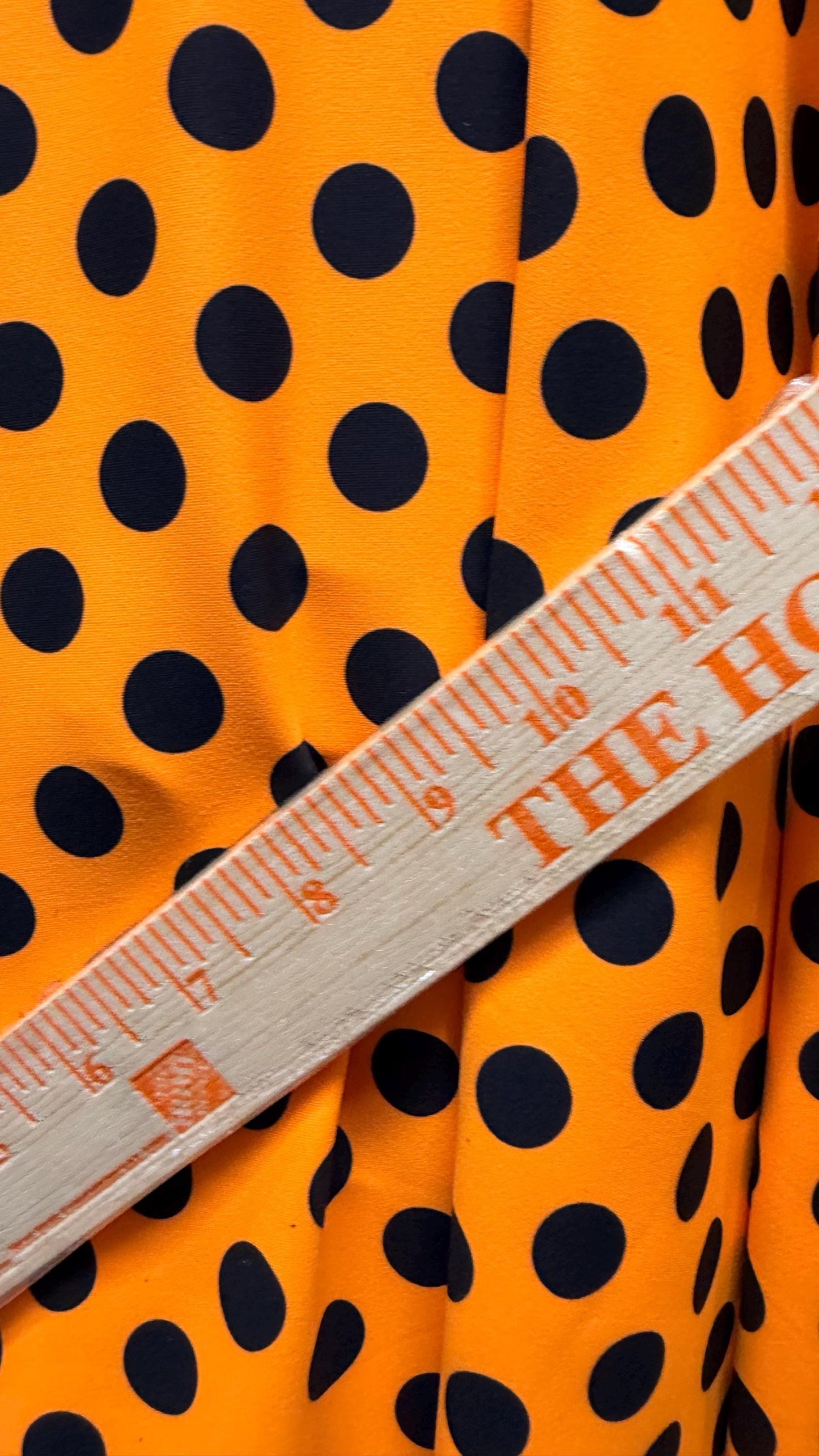 New polka dots design neon orange with black dots nylon spandex 4-way stretch 58/60” Sold by the YD. Ships worldwide from Los Angeles CA
