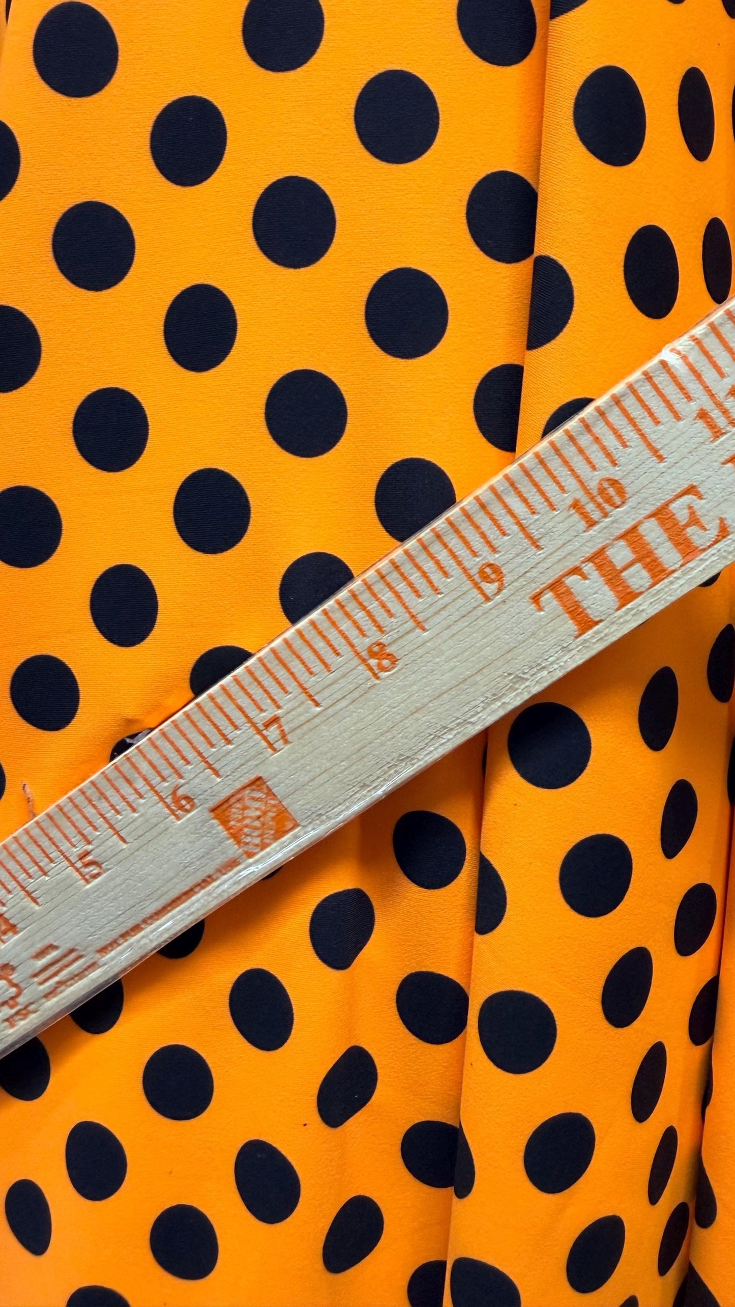 New polka dots design neon orange with black dots nylon spandex 4-way stretch 58/60” Sold by the YD. Ships worldwide from Los Angeles CA