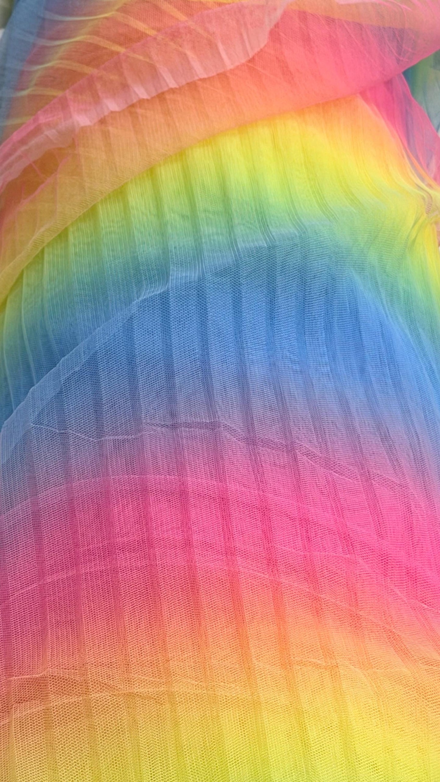 New Rainbow design print on pleated poly stretch mesh 2 way stretch 58/60" Sold by the YD. Ships worldwide from Los Angeles California USA.