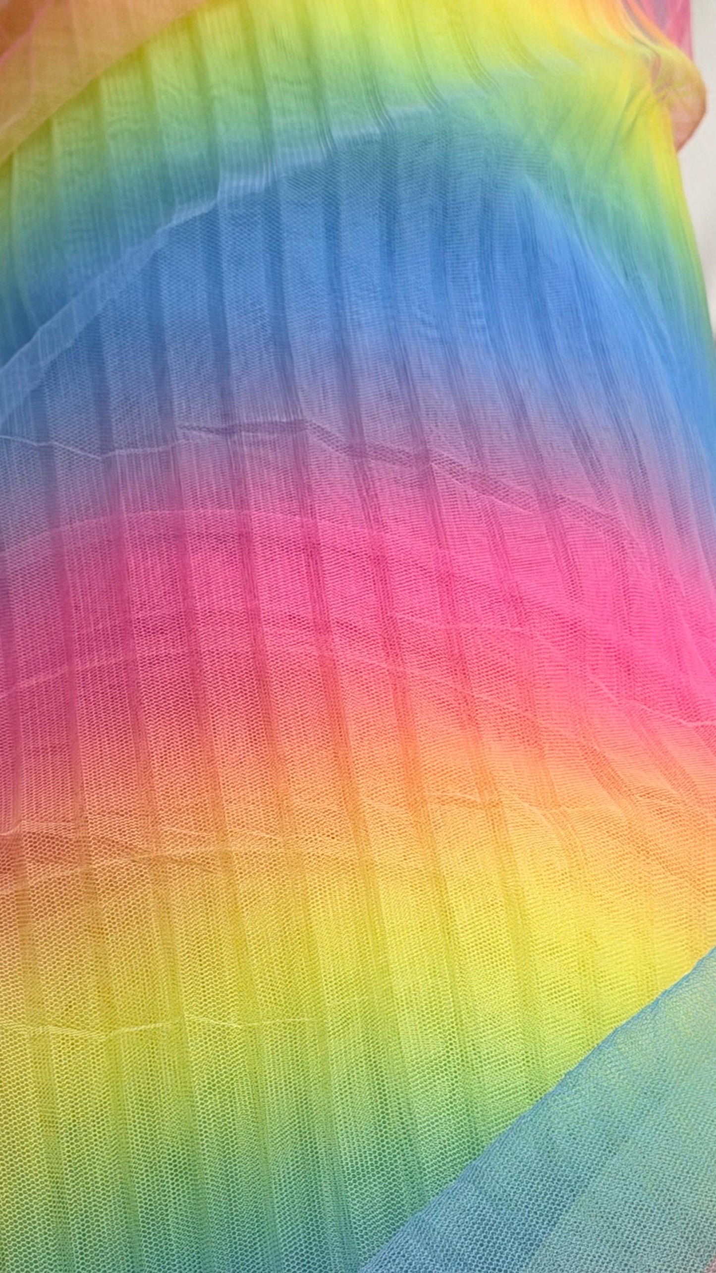 New Rainbow design print on pleated poly stretch mesh 2 way stretch 58/60" Sold by the YD. Ships worldwide from Los Angeles California USA.