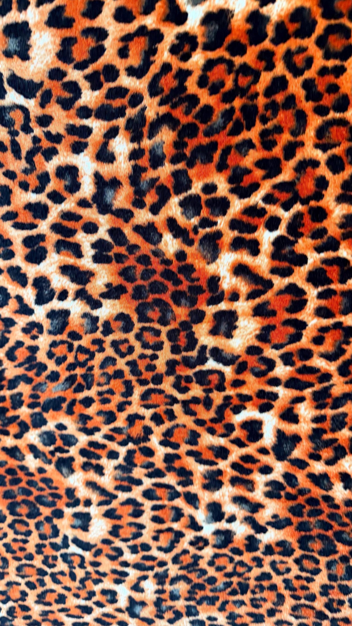 New Leopard print Orange/Black on heavy stretch velvet 4way stretch 58/60" Sold by the YD. Ships worldwide from Los Ángeles California USA.