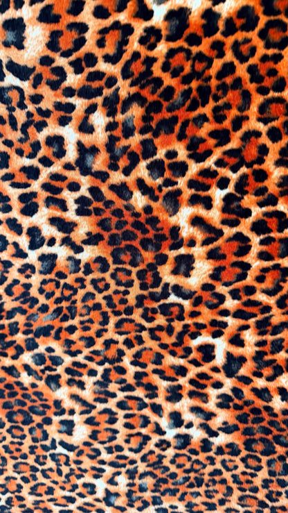 New Leopard print Orange/Black on heavy stretch velvet 4way stretch 58/60" Sold by the YD. Ships worldwide from Los Ángeles California USA.