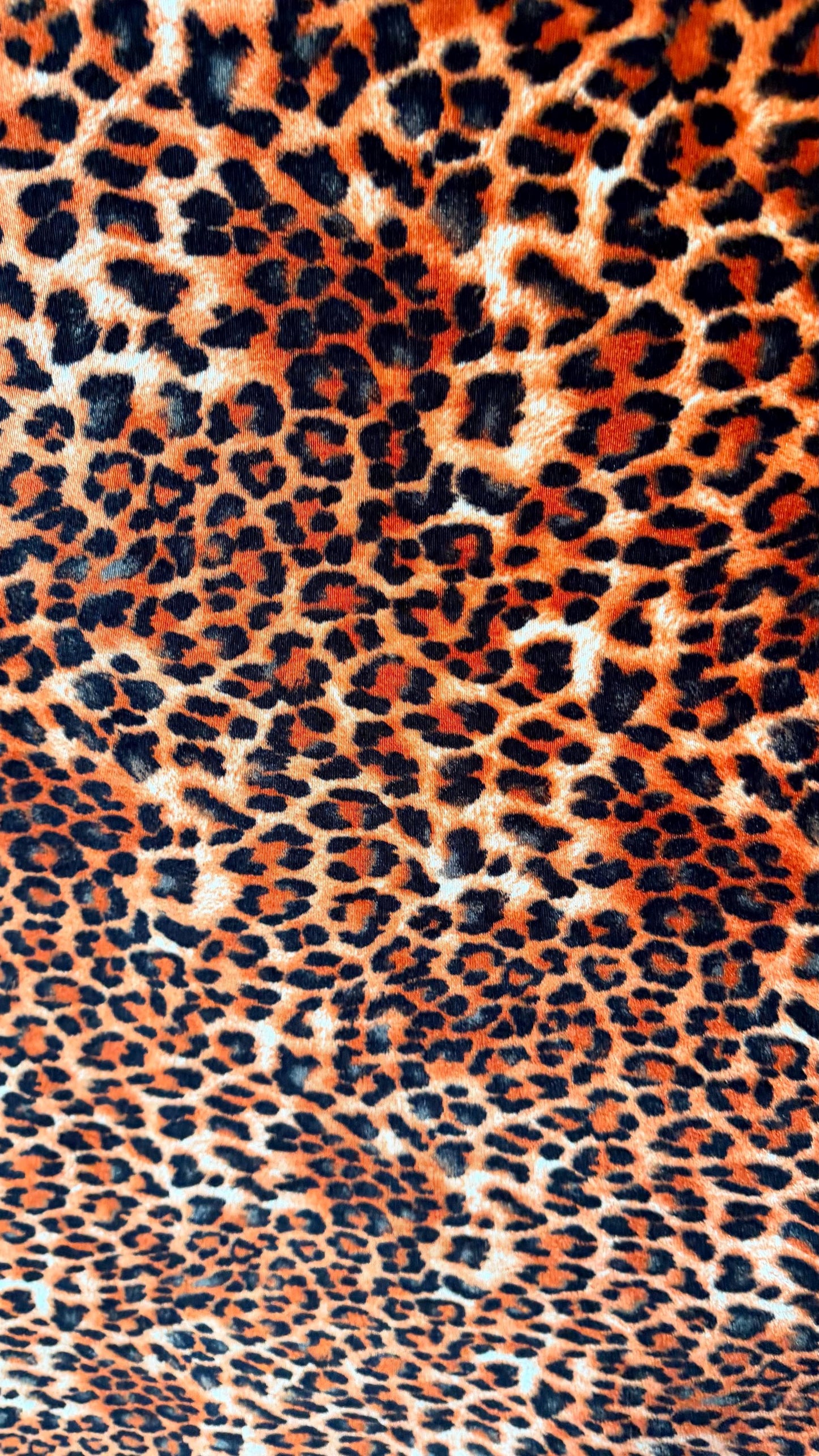 New Leopard print Orange/Black on heavy stretch velvet 4way stretch 58/60" Sold by the YD. Ships worldwide from Los Ángeles California USA.