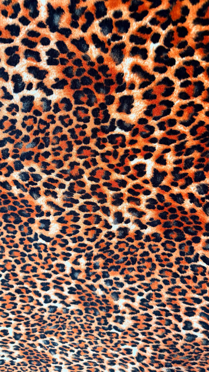 New Leopard print Orange/Black on heavy stretch velvet 4way stretch 58/60" Sold by the YD. Ships worldwide from Los Ángeles California USA.
