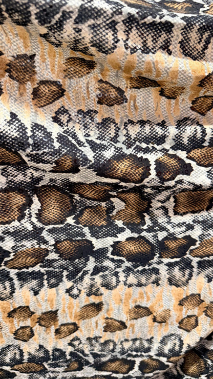 New Skin Snake design print on poly spandex with clear sequins  4-way stretch 58/60” Sold by the YD. Ships worldwide from Los Angeles CA
