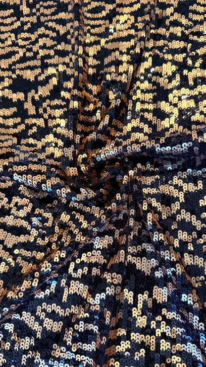 New Exotic leopard design Black/Gold on glitz cosmic sequins embroidered on powe mesh 2-way stretch 34/36” Sold by the YD.