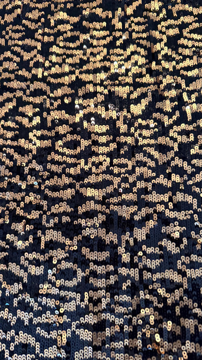 New Exotic leopard design Black/Gold on glitz cosmic sequins embroidered on powe mesh 2-way stretch 34/36” Sold by the YD.