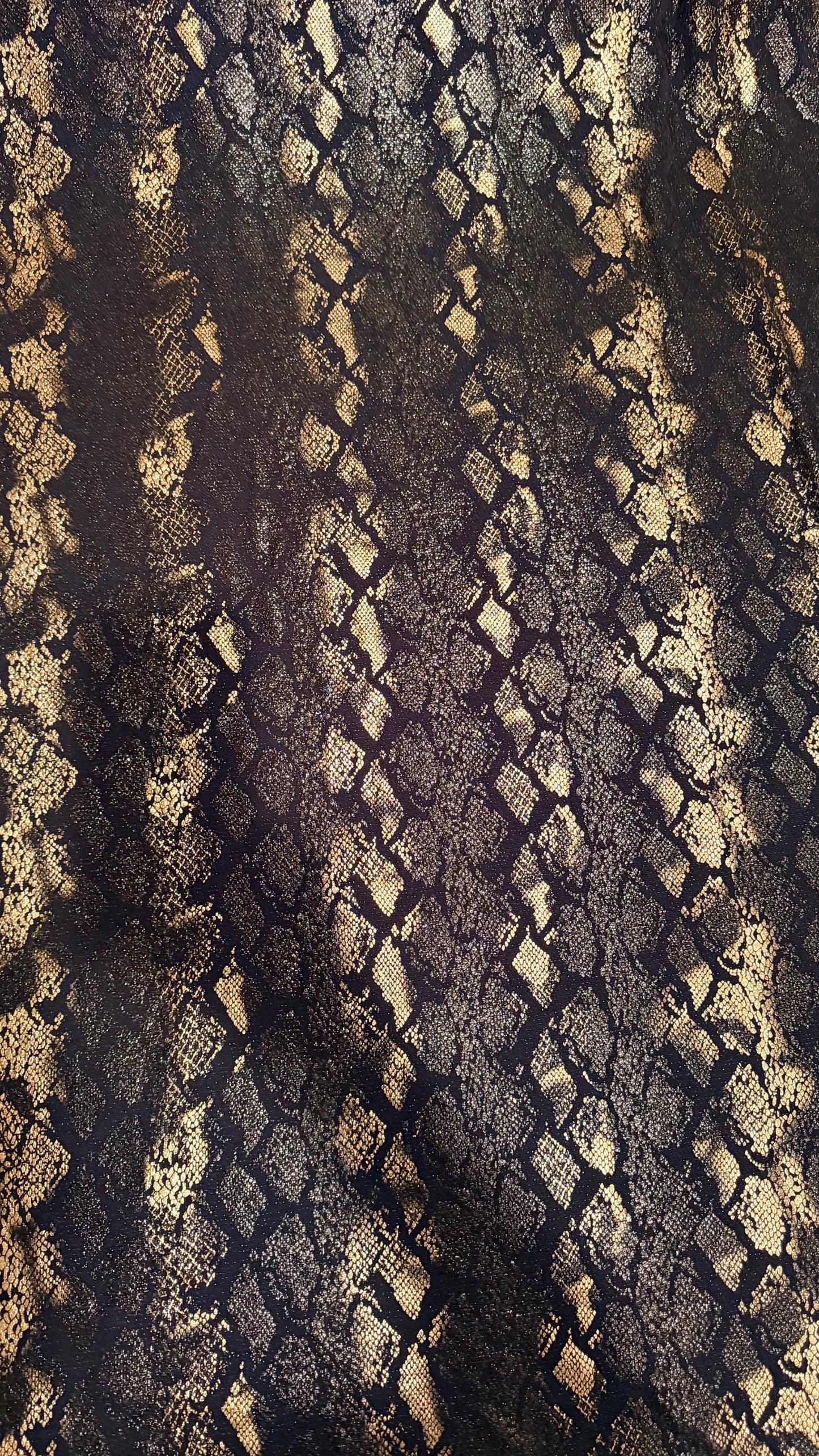 New Luxury snake design black/gold metallic nylon spandex with foil  4 way stretch 58/60” Sold by the YD. Ships worldwide from Los Angeles