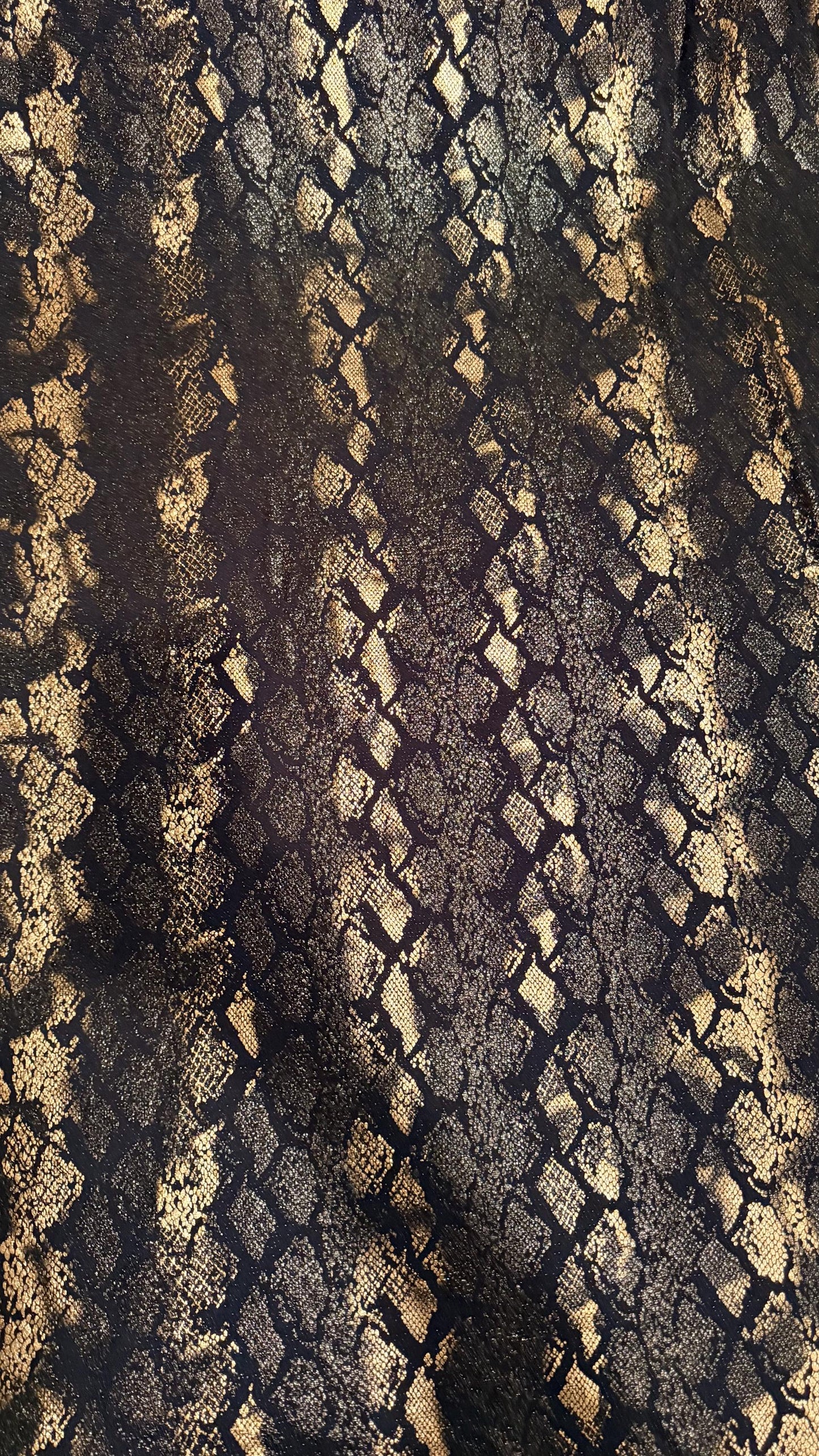New Luxury snake design black/gold metallic nylon spandex with foil  4 way stretch 58/60” Sold by the YD. Ships worldwide from Los Angeles