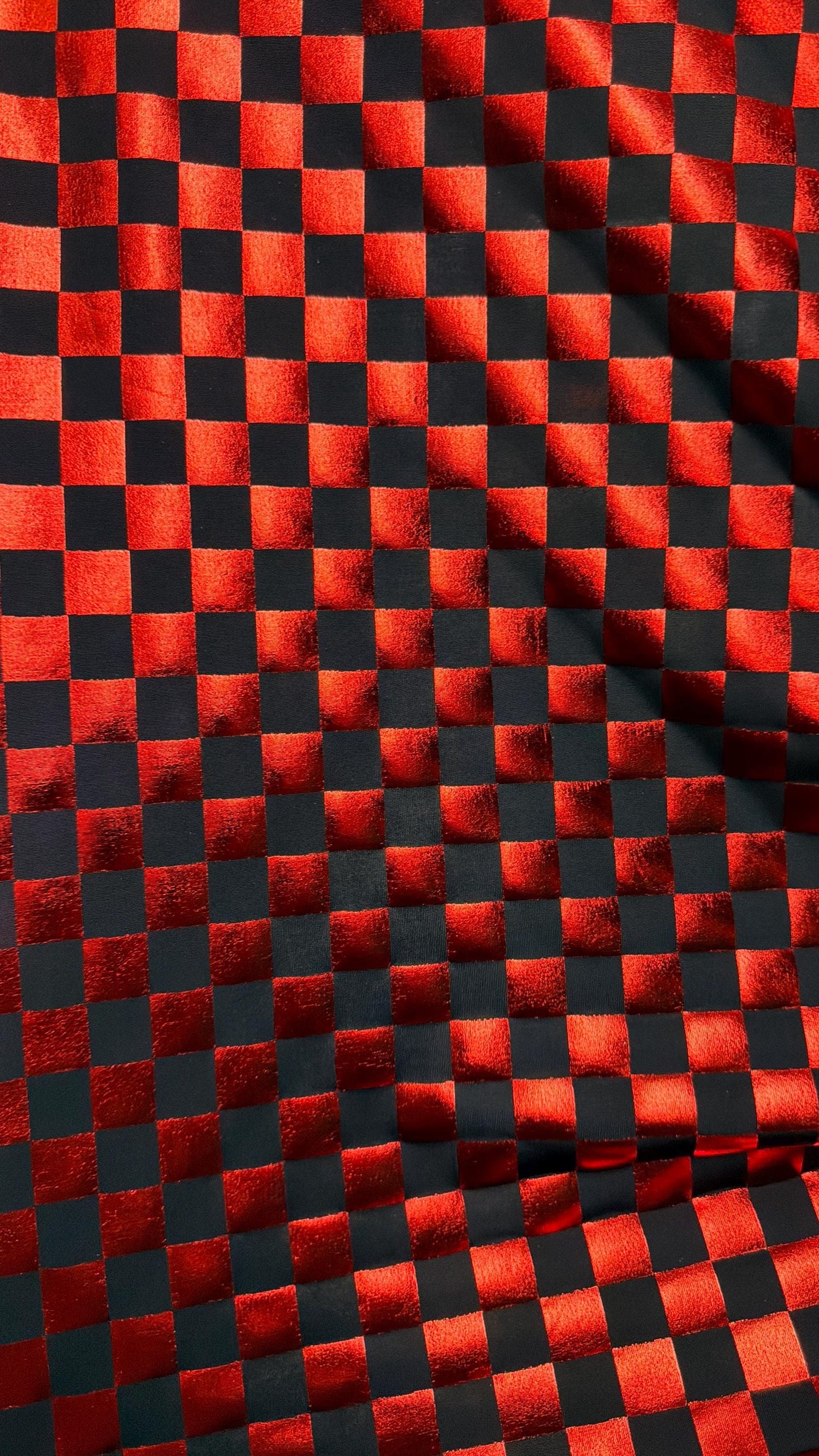 Checkered design metallic poly spandex Red/Black 2-way stretch 58/60” Sold by the YD. Ships Worldwide from Los Angeles California USA