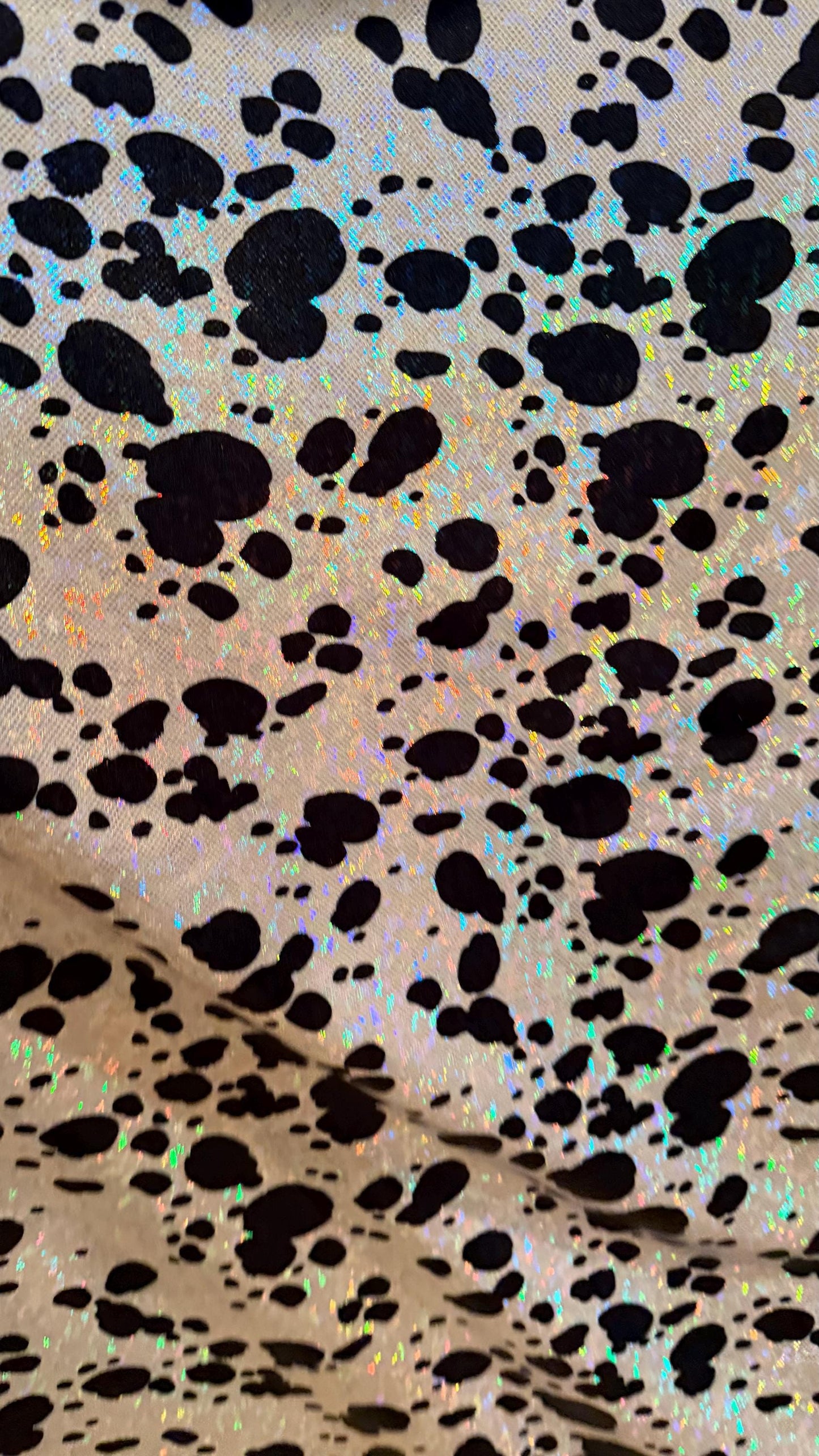 Dalmatian Exotic design w/silver/Black on shattered glass hologram metallic nylon spandex 4-way stretch 58/60” Sold by the YD. High quality